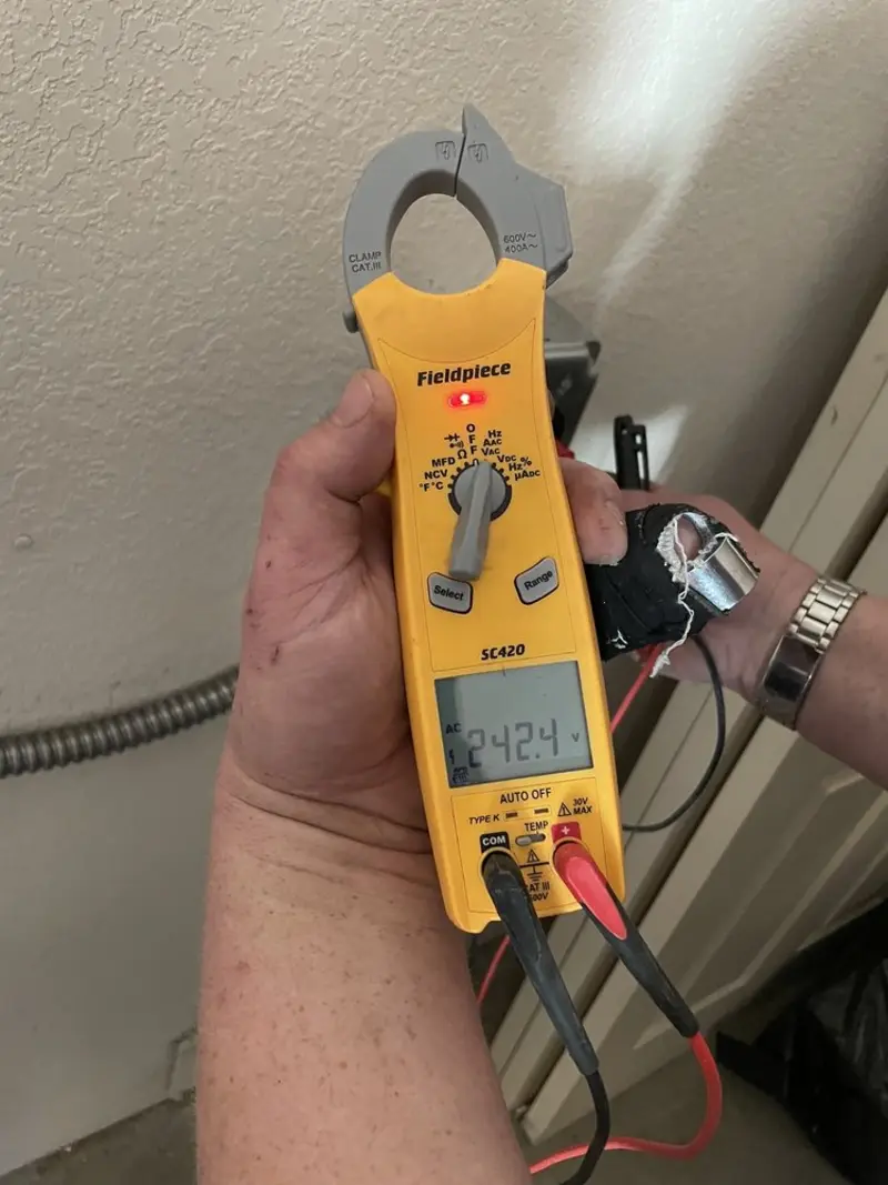 Voltage testing with clamp meter during Hot Tub / Pool Electrical Wiring in Independence